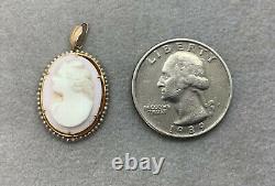 George L Paine Co 10K Left Facing Carved Angel Skin Cameo Pendant with Seed Pearls